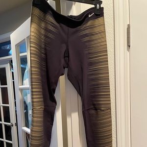 Nike leggings. Black with gold detail. Size Small.